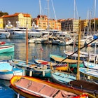 Nice, France - August 5, 2022: Nice port with yachts, boats and pierces in Nice Port and yacht marina district with Colline du Chateau Castle hill on French Riviera , License Type: media, Download Time: 2025-04-04T19:22:55.000Z, User: rhylton_redventures, Editorial: true, purchase_order: 65050 - Digital Destinations and Articles, job: Lonely Planet, client: App wip, other: Rhianydd Hylton