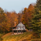 Cabin in the Woods Cloudy Day in Autumn in New England. Fall Foliage Colorful Trees., License Type: media, Download Time: 2025-07-08T16:40:11.000Z, User: Sarahstocking, Editorial: false, purchase_order: 65050 - Digital Destinations and Articles, job: Digital, client: Best place to book a cabin USA, other: Sarah Stocking