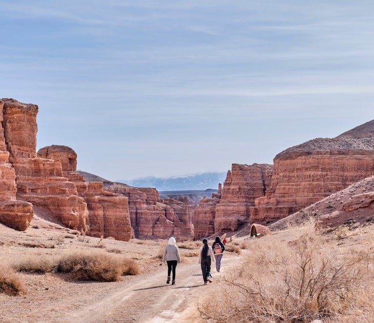 Almaty, Kazakhstan - March 19, 2024: National Nature Park Charyn Canyon in springtime. Valley of Castles. Natural monument, tourist landmark. People walking along road ., License Type: media, Download Time: 2025-07-04T09:50:19.000Z, User: clairenaylor, Editorial: true, purchase_order: 65050 - Digital Destinations and Articles, job: Online ed, client: Kazakhstan best things, other: Claire Naylor